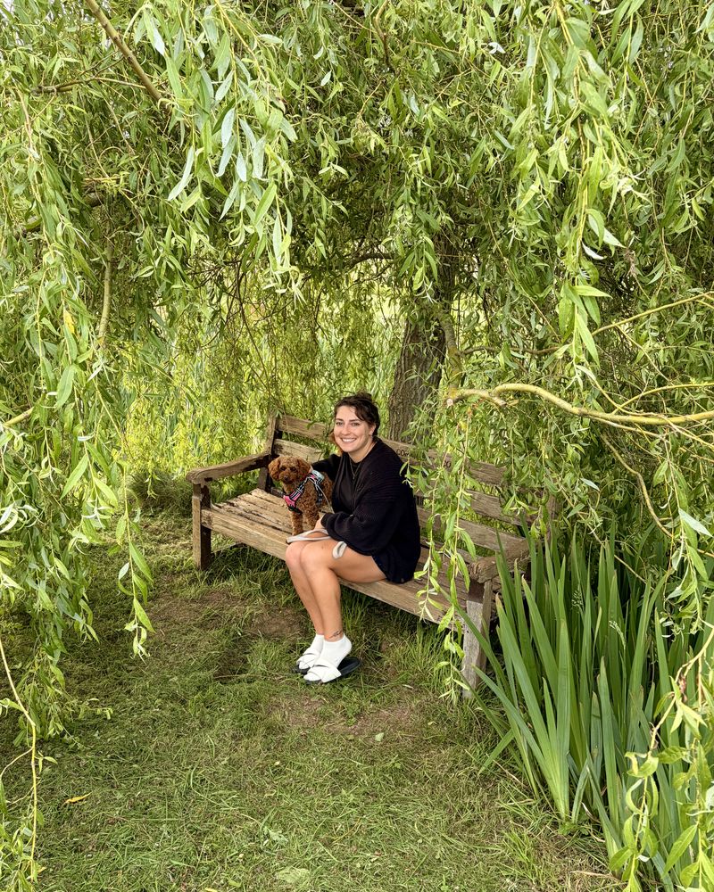 Hannah and Maple on a bench under a willow tree